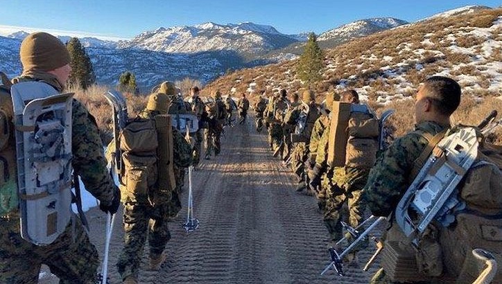 Marines march during a cold weather leadership course