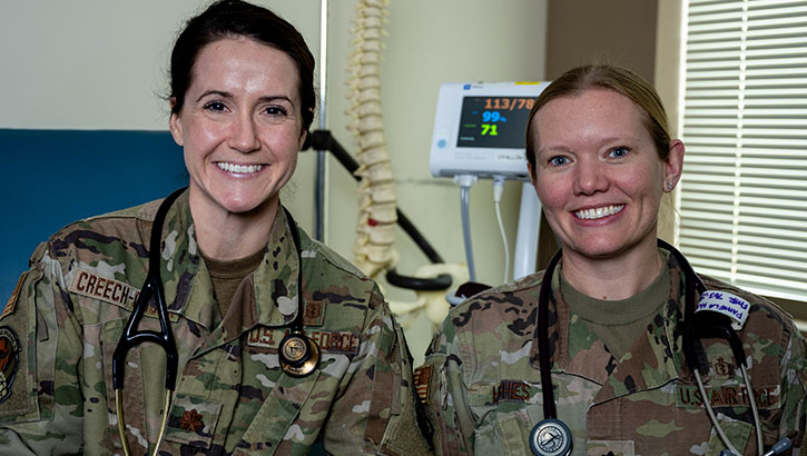 U.S. Air Force Maj. Julie Creech-Organ, 375th Healthcare Operations Squadron director of osteopathic education (left), and Lt. Col. Pamela Hughes, the unit’s military programs director, at Scott Air Force Base, Illinois, on Dec. 21, 2023. (U.S. Air Force photo by Senior Airman Violette Hosack)