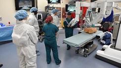 Second Lt. Nina Hoskins, 81st Surgical Operations Squadron operating room nurse, briefs Col. Debra Lovette, 81st Training Wing commander, and other base leadership on robotics surgery capabilities inside the robotics surgery clinic at the Keesler Medical Center June 16, 2017. (Photo: Kemberly Groue, U.S. Air Force)