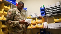 Tech. Sgt. Quentin Blash organizes medical supplies