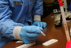 A specimen is tested for mononucleosis at the medical clinic on Ellsworth Air Force Base, South Dakota (U.S. Air Force photo)