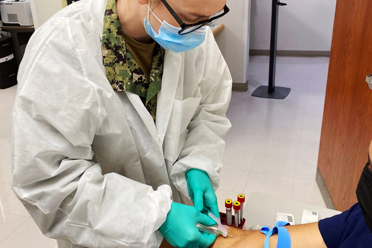 ALBANY, Ga. (May 11, 2022) - Hospital Corpsman 2nd Class Leeanna Grzemski, a lab technician at Naval Branch Health Clinic Albany, takes a blood sample. Grzemski, a native of Weatherford, Texas, says, “Best part of my job is meeting and interacting with our patients.” (U.S. Navy photo by Deidre Smith, Naval Hospital Jacksonville/Released).