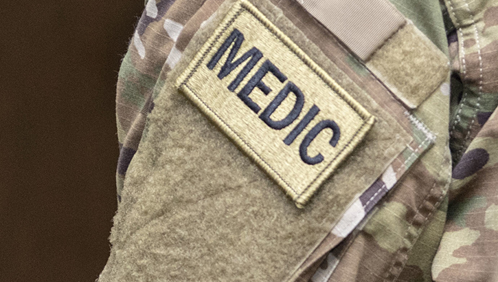 Arm band patch reading "MEDIC"