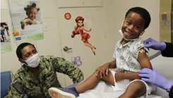 Samuel Thomas, age 4, gets his COVID-19 vaccination on Wednesday, July 20, 2022, becoming the first kid under the age of 5 to get vaccinated against COVID at Naval Health Clinic Patuxent River. As the son of, Capt. David Thomas, the clinic's commanding officer, he wanted to lead by example and show other kids that there's nothing to be scared of. (Photo: Kathy Hieatt)