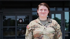 U.S. Army Spc. Anne Koller stands near the emergency entrance of Brooke Army Medical  Center