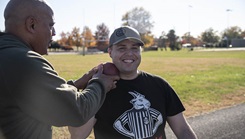 Two people with a shotput