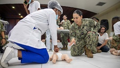 Military personnel demonstrating CPR