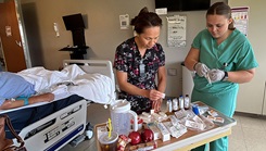 College nurses working in hospital room 