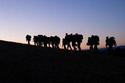 Marines hike to the next training location during Exercise Baccarat in Aveyron, Occitanie, France, Oct.16, 2021. Exercise Baccarat is a three-week joint exercise with Marines and the French Foreign Legion that challenges forces with physical and tactical training. Photo By: Marine Corps Lance Cpl. Jennifer Reyes