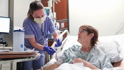 Military nurse tends to patient