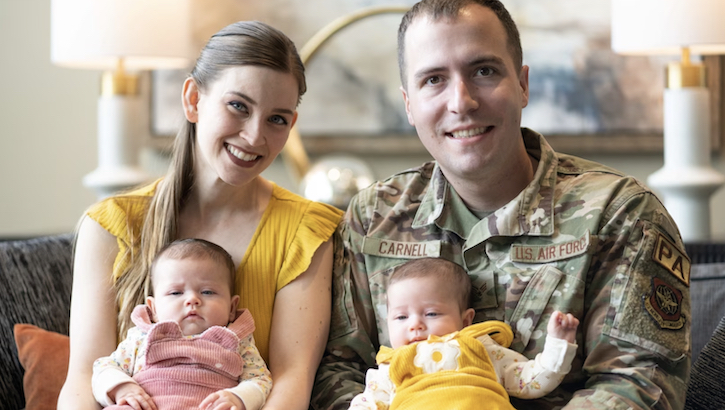 U.S. Air Force Senior Airman Jonathan Carnell, 60th Air Mobility Wing public affairs specialist from Travis Air Force Base, California, and his spouse, Micah, pose for a photo with their daughters in Vacaville, California, March 30, 2022. (U.S. Air Force photo by Chustine Minoda)