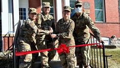 Military personnel at ribbon cutting ceremony