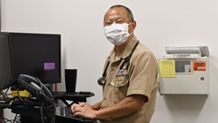 A naval doctor works on the new MHS GENESIS EHR.