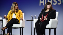 Dr. Terry Adirim, acting assistant secretary of defense for health affairs, right, speaks during a panel discussion.