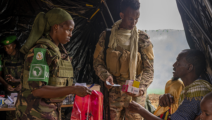 Kenya Defence Forces medical professionals fill out prescriptions for villagers during a medical civic action program event in Dolsan village, Somalia, on July 1, 2023. More than 250 people came to seek medical aid, ranging from dengue fever to urinary tract infections. (U.S. Air Force photo by Staff Sgt. Enrique Barcelo) 