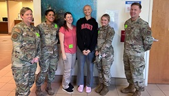 U.S. Air Force Senior Airman Matilyn Million, 6th Medical Support Squadron laboratory technician, stands next to her coworkers during a chemotherapy appointment in Tampa, Florida, on Aug. 21, 2023. Million was diagnosed with stage III Hodgkin’s lymphoma in March 2023. She completed her 12th and final chemotherapy treatment on Sept. 18, 2023, and is currently cancer free. (Courtesy Photo)