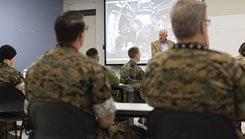 U.S. Navy Rear Adm. (Ret.) Thomas Cullison, former deputy surgeon general, U.S. Navy, teaches fundamentals of global health engagement to a class