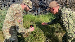 U.S. Navy Lt. Thomas McGlynn, of Navy Entomology Center of Excellence, and U.S. Army Capt. Mark Kartzinel, of Army Public Health Command East, select sites for mosquito surveillance, a form of surveillance where a container of water is used to collect eggs from mosquitoes, at Naval Station Guantanamo Bay, on Jan. 14, 2024. (Photo by James Butler/U.S. Navy)