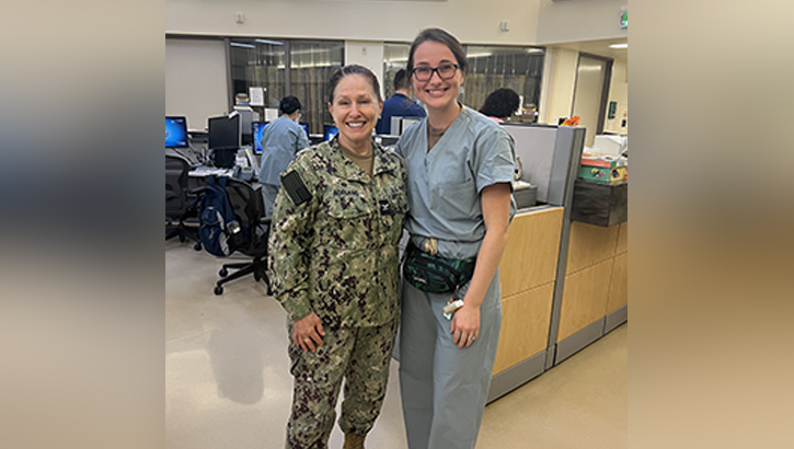 U.S. Navy Capt. Elizabeth Adriano, left, Naval Medical Center San Diego director, poses with U.S. Navy Ens. Sarah Martin, a nurse at NMCSD. Adriano delivered Martin at NMCSD in 1999. (Photo by Marcelo Calero/Naval Medical Center San Diego)