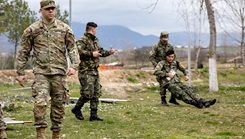 U.S. Army National Guard Staff Sgt. James Cavanagh, 2nd Battalion, 113th Infantry Regiment, 44th Infantry Brigade Combat Team, New Jersey Army National Guard, supervises tactical combat casualty care training scenarios with the Albanian Armed Forces at Land Forces Headquarters, Zall-Herr, Tirana, Albania as part of the State Partnership Program. (Photo by Staff Sgt. Bruce Daddis, U.S. Army National Guard) 