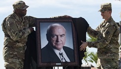 Air Force Col. Alfred Flowers, 99th Medical Group commander, and Army Staff Sgt. Michael O’Callaghan, (grandson of the former Gov. O’Callaghan) reveal a portrait of O’Callaghan during a ceremony celebrating the Mike O’Callaghan Military Medical Center’s 25th Anniversary on Nellis Air Force Base, Nevada, Nov. 12, 2019. The portrait will hang in the MOMMC to honor the center's namesake. (U.S. Air Force photo by Senior Airman Kevin Tanenbaum)