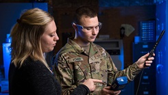 Defense Centers for Public Health-Aberdeen industrial hygienist Emma Bieniek and U.S. Army Spc. Jeremy Rohrer use a Q-Trak direct reading instrument to assess indoor air quality parameters at the Edgewood Area of Aberdeen Proving Ground, Maryland. DCPH-A’s occupational medicine and industrial hygiene specialists work together to understand what issues Department of Defense civilian and military staff are facing in the various workplaces. (Photo by Graham Snodgrass, Defense Centers for Public Health-Aberdeen) 