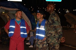 Dr. James Geiling (center), at the time an Army colonel in charge of the Pentagon's DiLorenzo Tricare Health Clinic, talks with local first responders and senior military commanders after the terrorist attack on the Pentagon on Sept. 11, 2001.