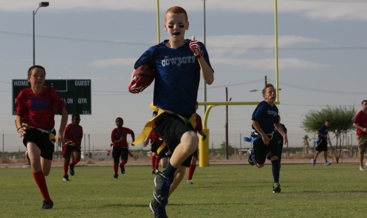 Link to Photo: Youth participate in a flag football game on Marine Corps Air Station in Yuma, Arizona. (U.S. Marine Corps photo by Sgt. Travis Gershaneck)