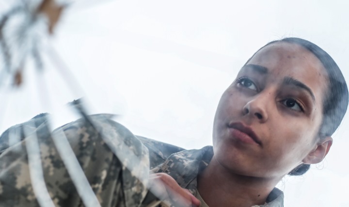 Link to Photo: Army Private 1st Class Luselys Lugardo, a soldier assigned to the New Jersey Army National Guard, poses in front of a shattered mirror for a portrait. The shattered glass represents the way suicide hurts families, friends and coworkers. (U.S. Air Force photo by Tech. Sgt. Matt Hecht)