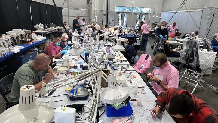 Members of the 21st Dental Squadron construct dental prosthetics during the Mission of Mercy free dental clinic, Sept. 22, 2023, in Greeley, Colorado. 
