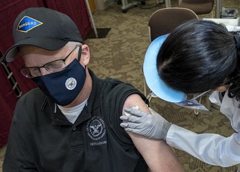 Man getting vaccine in arm