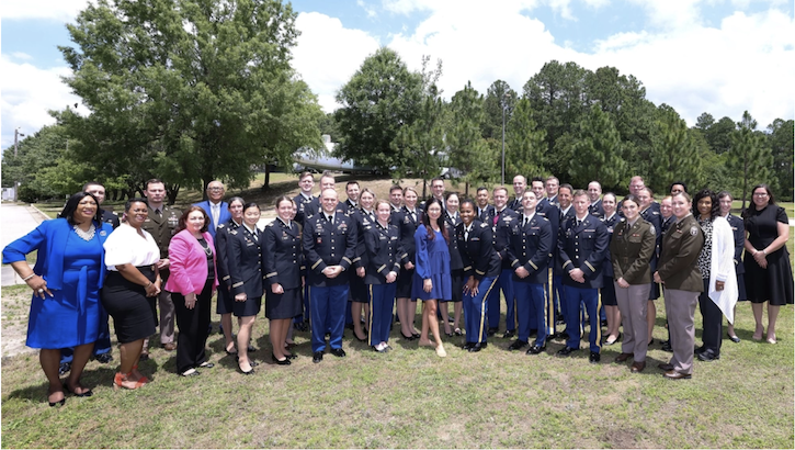 Womack Army Medical Center GME program directors, graduates and program coordinators pose for a picture. 