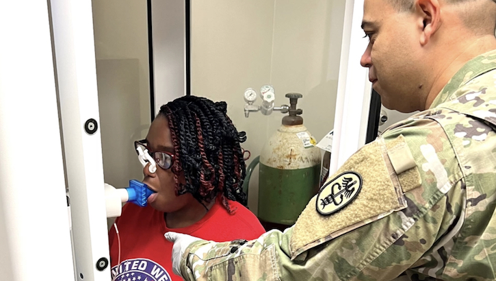  Staff Sgt. Adolfo Uribe, outpatient pulmonary services noncommissioned officer in charge for William Beaumont Army Medical Center, Fort Bliss, Texas conducts a pulmonary functions test on Jen'et Celestine Dec. 11 at Bayne-Jones Army Community Hospital, Fort Johnson, Louisiana. (Photo: Jean Graves)