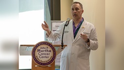 U.S. Navy Lt. Cmdr. Matt Nealeigh, director of the breast care and research center at Walter Reed National Military Medical Center, delivers remarks for the opening ceremony of the Walter Reed Cancer Survivorship two-day event. (Photo: U.S. Navy Petty Officer 1st Class Kurtis Hatcher, Walter Reed National Military Medical Center)