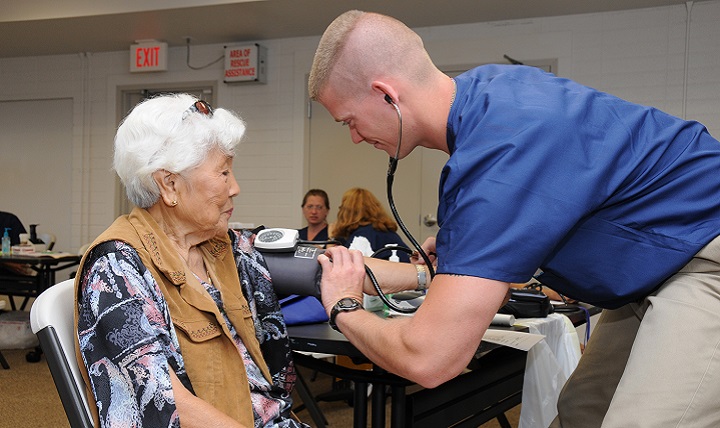 Link to Photo: Air Force Staff Sgt. Nick Crouse, a medical technician with the 193rd Special Operations Wing's Medical Group out of Middletown, Pennsylvania, takes the blood pressure of a patient. Heart disease, diabetes, and chronic obstructive pulmonary disease are three ailments that take a huge toll on the body as it ages. (U.S. Air Force photo)