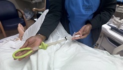 A member of the Family Birthing Center demonstrates the Jada® system used to control uterine bleeding on a simulated patient at the Keesler Military Treatment Facility, Keesler Air Force Base, Biloxi, Miss., Oct. 30 (Photo By Michelle Stewart)