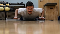 U.S. Air Force Airman Ethan Broussard doing pushups