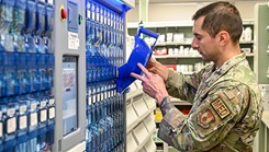 U.S. Air Force Technical Sgt. Marco Cardenas, 75th Medical Group Pharmacy Flight, restocks medications in the Parata Max 2 automated medication filling robot Oct. 26, 2023, at Hill Air Force Base, Utah. The pharmacy recently acquired the robot, which has reduced prescription filling times for their patients and furthered patient safety by using stock bottle and storage cell scanning to dispense the right drug and the right dose. (U.S. Air Force photo by Cynthia Griggs) 