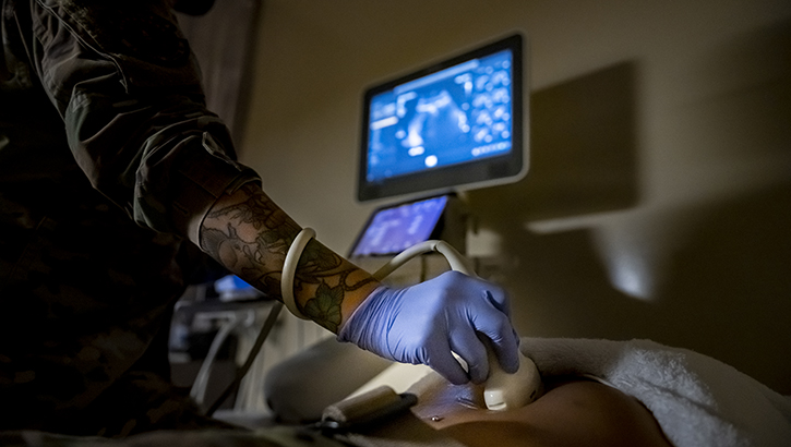 U.S. Air Force Tech. Sgt. Leila Liza Smith, a diagnostic imaging specialist with the 6th Medical Group, practices abdominal ultrasound procedures at MacDill Air Force Base, Florida, on ct. 25, 2022. Smith evaluates the images produced by the ultrasound for abnormalities, such as lumps or nodules on the thyroid gland. (Photo by U.S. Air Force Senior Airman Lauren Cobin)