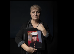 Virginia Cooper holding picture of her son Joshua James Wood